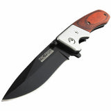 Folding knife with wooden handle and black blade on a white background