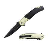 Folding knife with black blade and beige handle on a white background