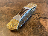 Handmade Damascus Steel Engraved Bolster foldable knife with decorative handle on a textured surface