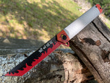  Kyojuro Rengoku Demon Slayer folding pocket knife open showing black tanto blade with red flame art and sleek white handle with flame guard pivot medallion.