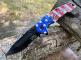 USA 250 Years commemorative folding pocket knife open on a log showing black semi serrated blade and full color American flag aluminum handle scale.