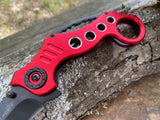  Close up of finger ring and drilled holes on Tac-Force red tactical folding knife.