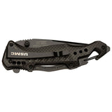 "Back of USMC tactical knife showing heavy-duty pocket clip and integrated carabiner clip."