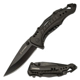 USMC officially licensed spring assisted tactical knife with black carbon fiber pattern handle and drop point blade."