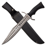 Survivor fixed-blade bowie knife with etched skull pattern blade and black sheath on a white background