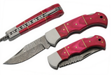 Two pink-handled Damascus steel folding knives on a white background