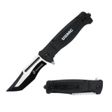 The knife open at an angle showing the distinct two-tone contrast on the tanto blade profile and the clear "USMC" text on the handle.