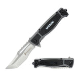  The knife fully deployed against a concrete or asphalt background to complement the grey handle tone.