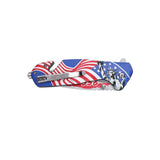 Close up of integrated seatbelt cutter and glass breaker on patriotic pocket knife.