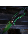 Green folding knife on a textured surface