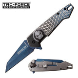 Tac-Force TF-951BL Midnight Ops spring assisted knife open showing blue titanium nitride coated stainless steel blade and silver honeycomb skull handle pattern.
Tac-Force TF-951BL folding tactical pocket knife closed showing the tip-down stainless steel pocket clip and detailed skull emblem handle layout.